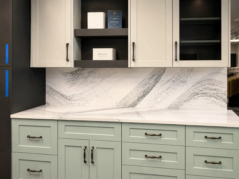 Sage cabinet and veined countertop display inside the Classic Floors showroom