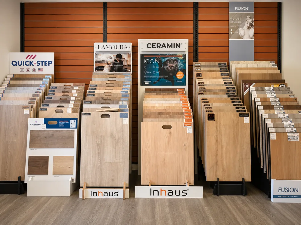 Wood-look flooring sample wall inside the Classic Floors showroom