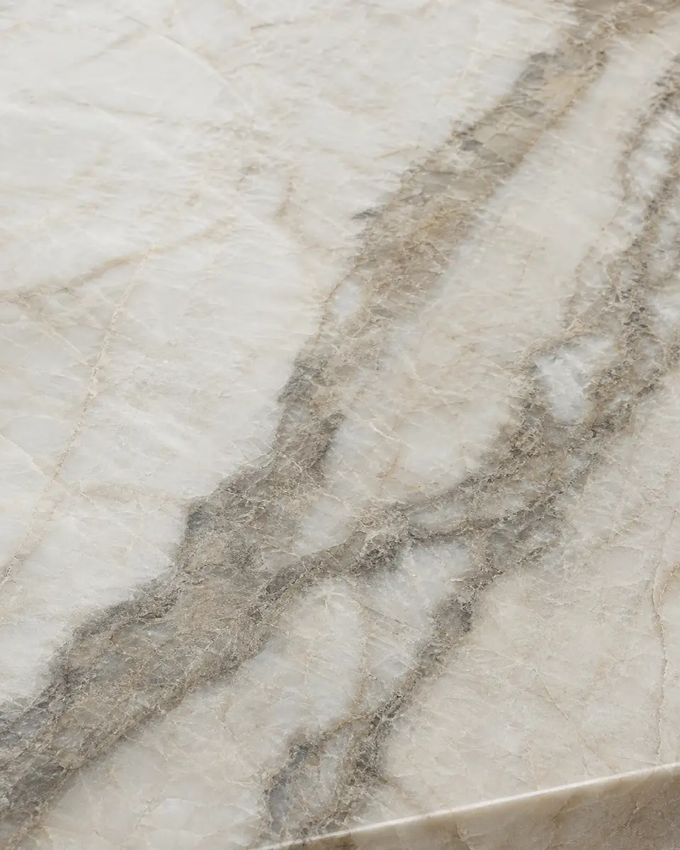 Natural quartzite slab with dramatic taupe veining and a marble look